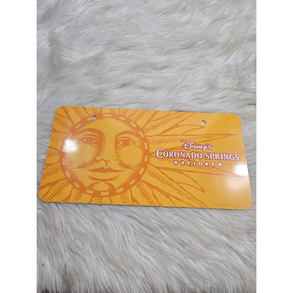 Vintage Disney Coronado Springs Resort Plastic License Plate Yellow Sun